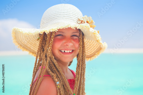 Photo: girl with straw hat smiling girl with straw hat smiling