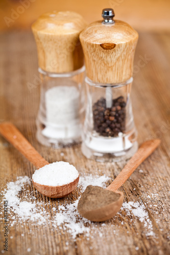 Photo: salt and pepper in spoons and shakers salt and pepper in spoons and shakers
