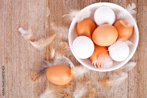 Photo: brown and white eggs in a bowl brown and white eggs in a bowl
