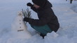 Video: Young woman arrange her snowman, winter time Young woman arrange her snowman, winter time