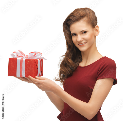 Photo: teenage girl in red dress with gift box teenage girl in red dress with gift box
