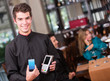 Waiter holding a dataphone