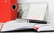 Pen on an opened notebook
