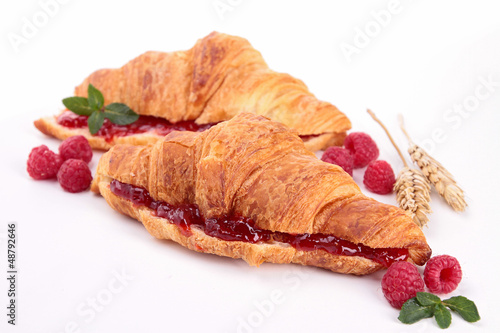 Photo: isolated croissant with berries isolated croissant with berries
