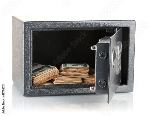 Photo: Money in open safe isolated on white Money in open safe isolated on white