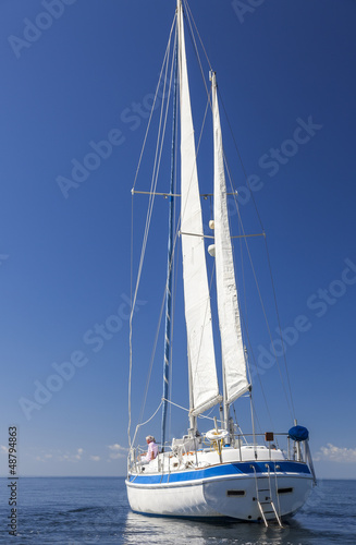 Photo: Happy Senior Couple On Front of a Sail Boat Happy Senior Couple On Front of a Sail Boat