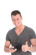 Smiling man giving a thumbs up