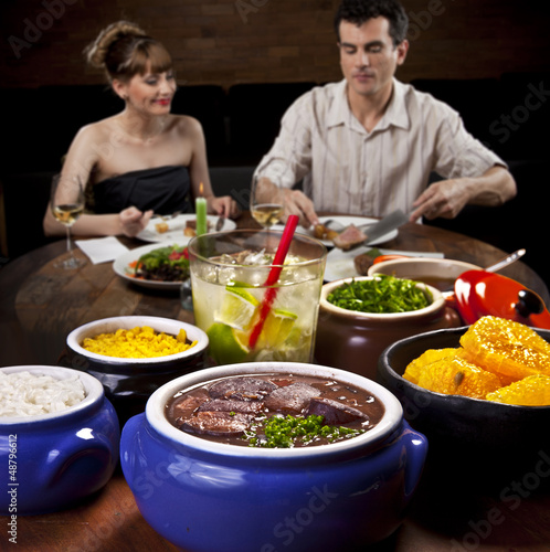 Photo: Feijoada - Brazilian meat & bean stew, side dishes & caipirinha Feijoada - Brazilian meat & bean stew, side dishes & caipirinha