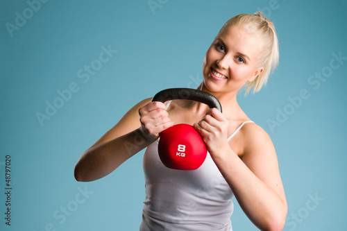 Photo: Girl and kettlebell Girl and kettlebell