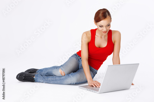 Photo: Student working on her laptop Student working on her laptop