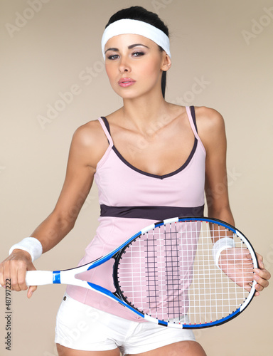 Photo: Attractive woman with a tennis racquet Attractive woman with a tennis racquet