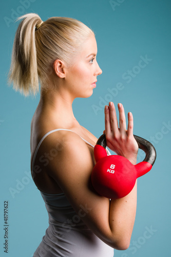 Photo: Girl and kettlebell Girl and kettlebell