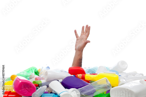 Photo: Environment concept with human hand and plastic recipients Environment concept with human hand and plastic recipients
