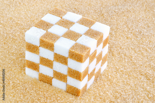 Photo: Cube of brown and white sugar cubes Cube of brown and white sugar cubes