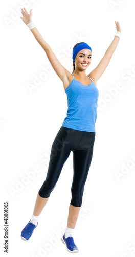 Photo: Cheerful young jumping woman, over white Cheerful young jumping woman, over white