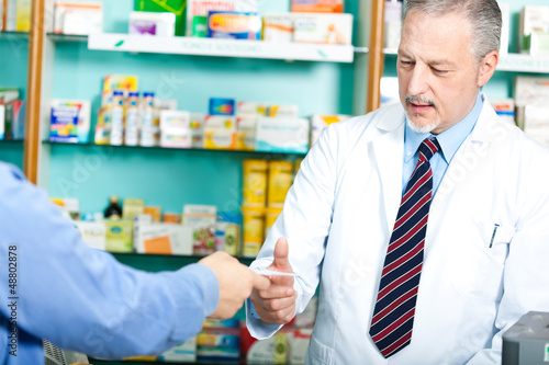Photo: Pharmacist in his shop Pharmacist in his shop