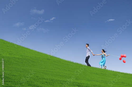 Photo: Beautiful landscape and couple on hill Beautiful landscape and couple on hill