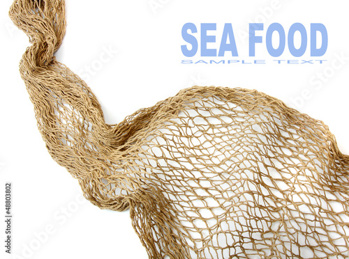 Photo: Fishing net on a white background. Fishing net on a white background.