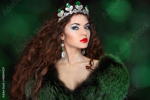 Photo: Beautiful woman in luxury fur coat. Jewelry and Beauty. Fashion Beautiful woman in luxury fur coat. Jewelry and Beauty. Fashion