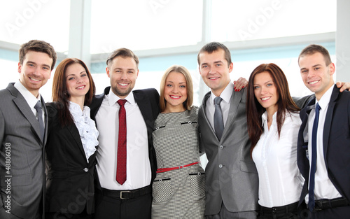 Photo: Closeup portrait of a successful business team laughing together Closeup portrait of a successful business team laughing together