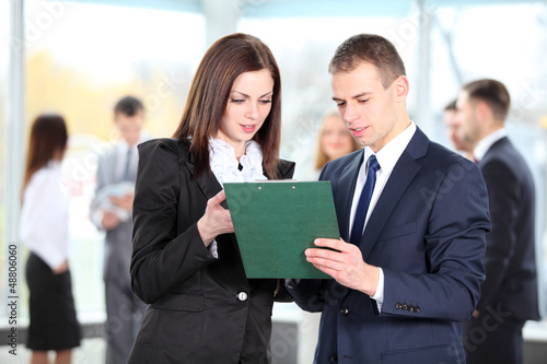 Photo: Image of two business partners planning work Image of two business partners planning work