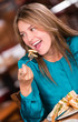 Happy woman eating