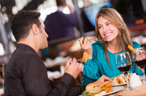 Photo: Friends eating at a restaurant Friends eating at a restaurant