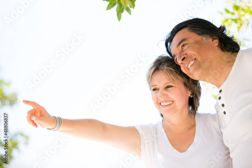 Photo: Beautiful couple pointing outdoors Beautiful couple pointing outdoors