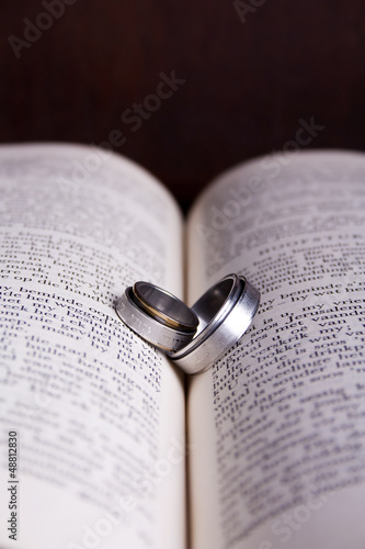 Photo: Two Hebrew wedding rings on an open Afrikaans Bible Two Hebrew wedding rings on an open Afrikaans Bible