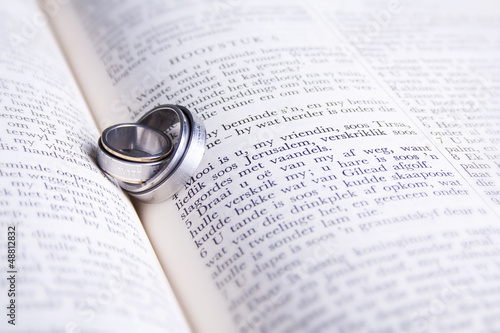 Photo: Two Hebrew wedding rings on an open Afrikaans Bible Two Hebrew wedding rings on an open Afrikaans Bible