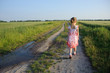 little girl walking on the road