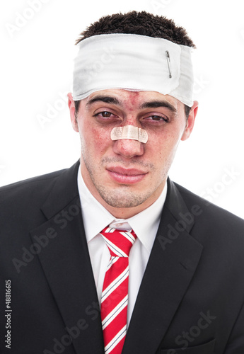 Photo: Beaten business man, close-up isolated on white Beaten business man, close-up isolated on white