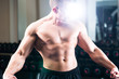 Bodybuilder posing in Gym