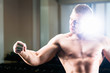 Bodybuilder posing in Gym