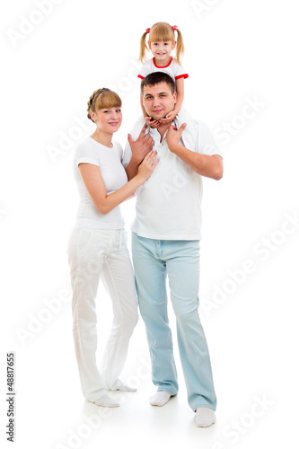 Photo: Happy young family isolated on white background Happy young family isolated on white background