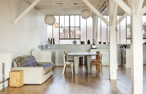 Photo: wide room of loft, beams and wooden floor wide room of loft, beams and wooden floor