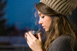 Young brunette with hot tea.