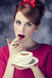 Redhead girl with cup of coffee for St. Valentine's Day.