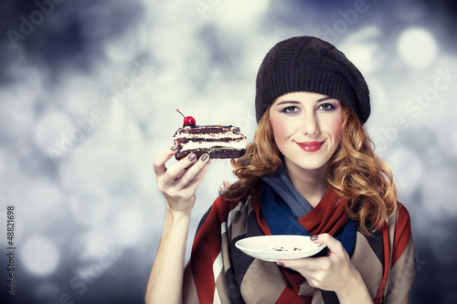 Photo: Style girl with cake and bokeh at background. Style girl with cake and bokeh at background.