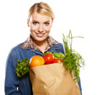 woman holding a bag full of healthy food. shopping .