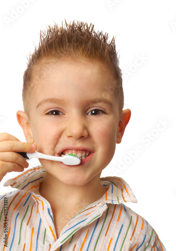 Photo: smiley boy cleans a teeth smiley boy cleans a teeth