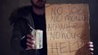 Video: homeless hold out a tin and a cardboard homeless hold out a tin and a cardboard
