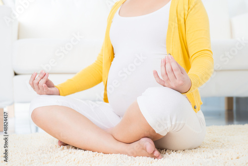 Photo: Pregnant woman meditating Pregnant woman meditating