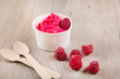 Frozen creamy ice yoghurt  with whole raspberries
