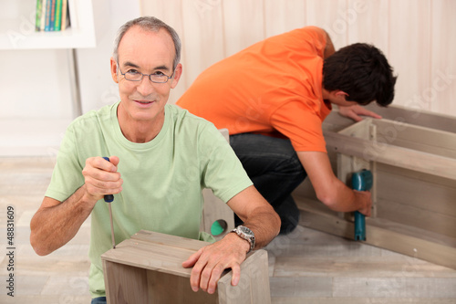 Photo: Father and son building furniture Father and son building furniture