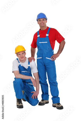 Photo: A team of tradesmen posing for the camera A team of tradesmen posing for the camera
