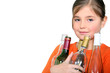 Little girl carrying glass bottles