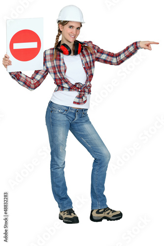 Photo: Woman directing traffic Woman directing traffic