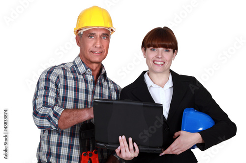 Photo: Architect and foreman stood with laptop Architect and foreman stood with laptop