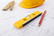 Hard hat and tools on a blueprint